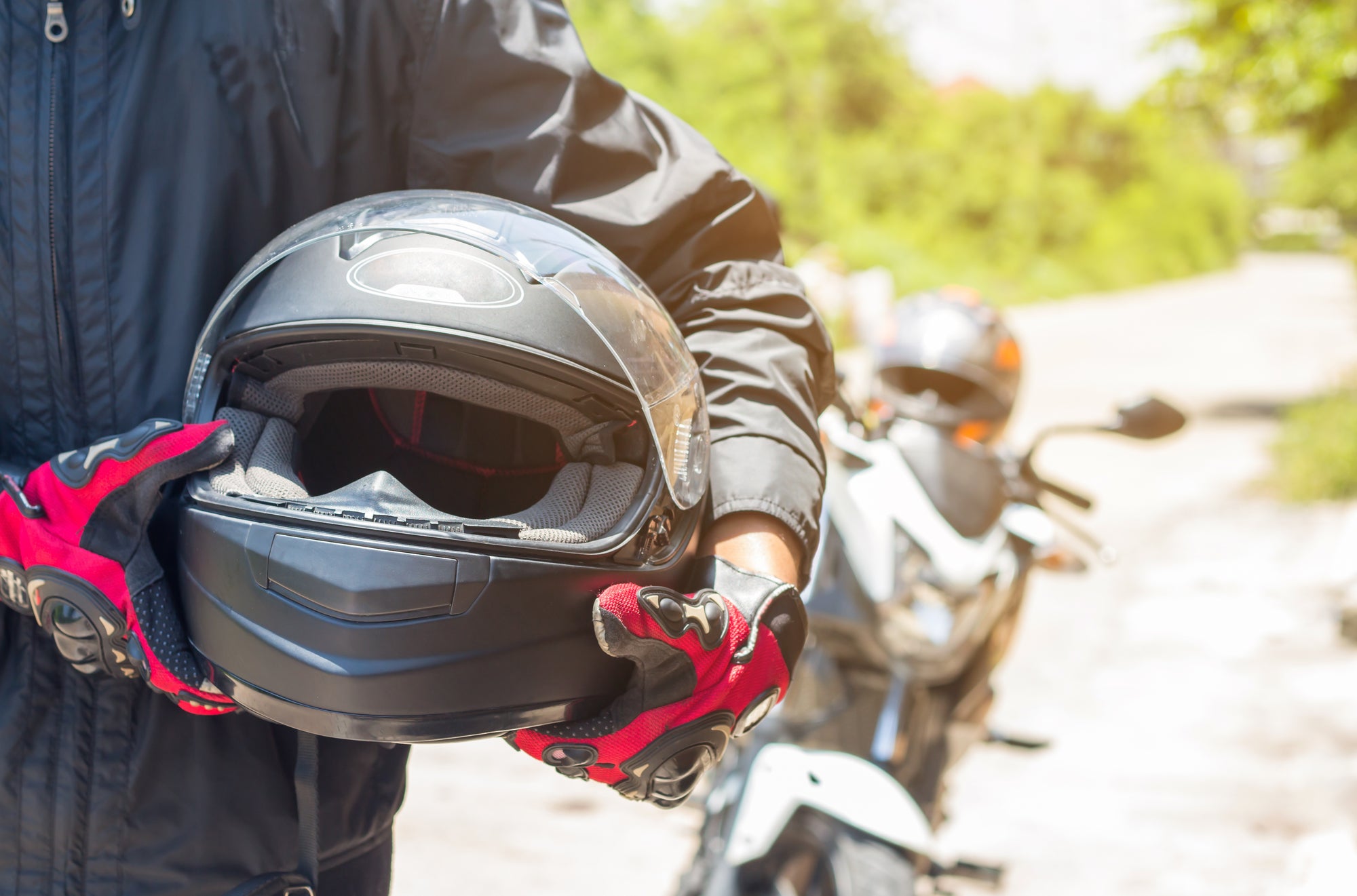 a person wearing motorcycle helmets Helmet Cover - Merman This Merman Motorcycle Helmet Cover will turn heads everywhere you ride Person wearing helmet Images -